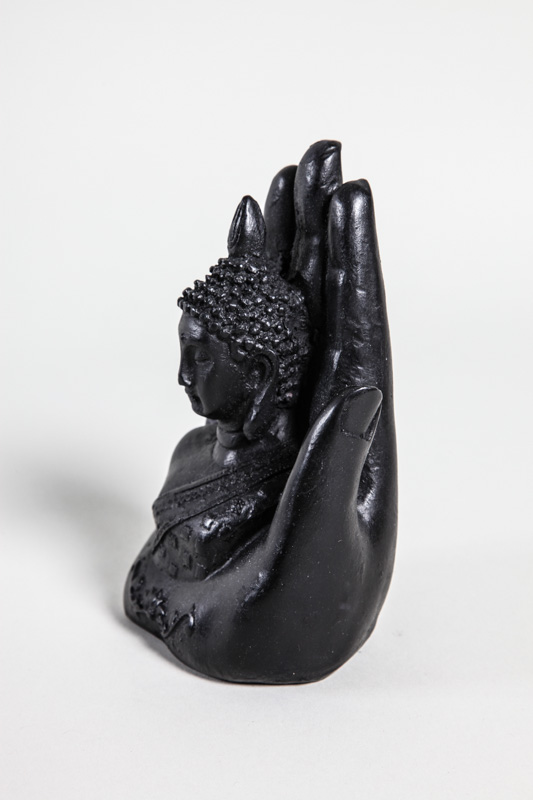 Buddha in Hand schwarz